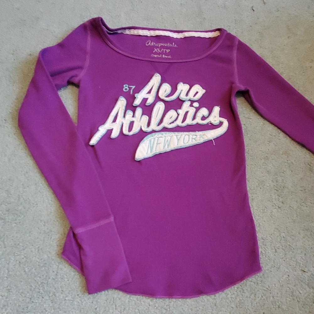 A purple long sleeved Aero Athletics shirt